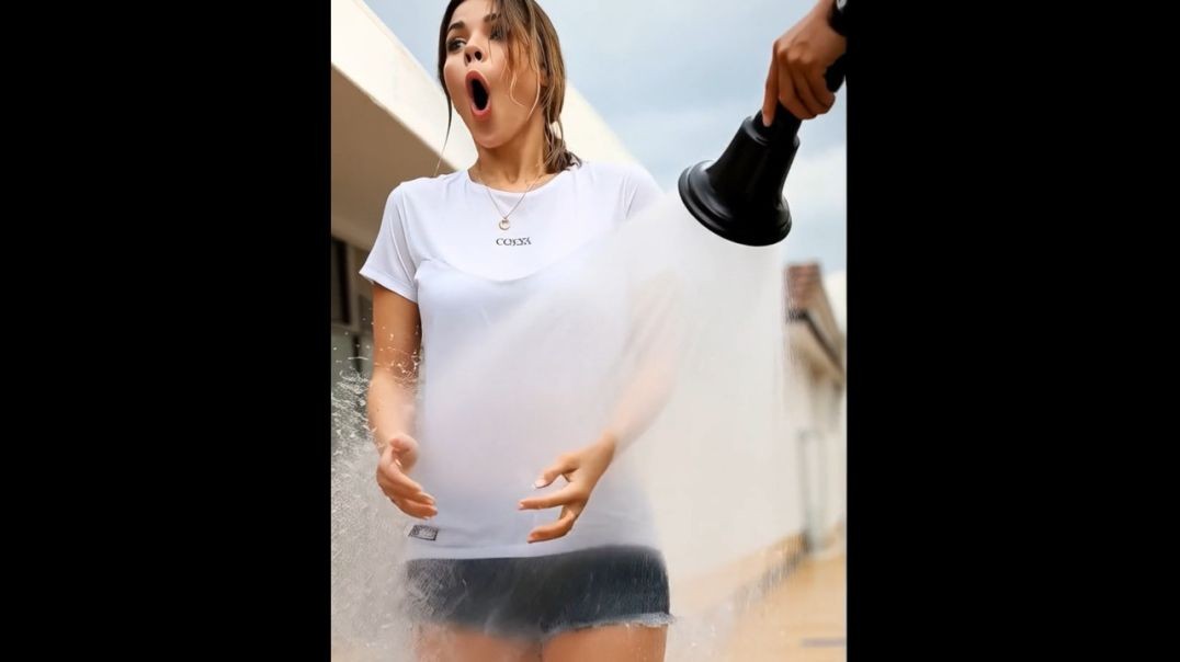 Sprayed with the hose in white shirt and denim shorts