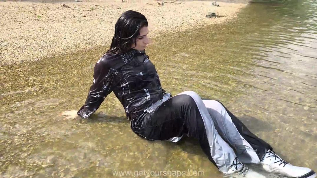 ⁣Brenda is bathing in the river fully clothed